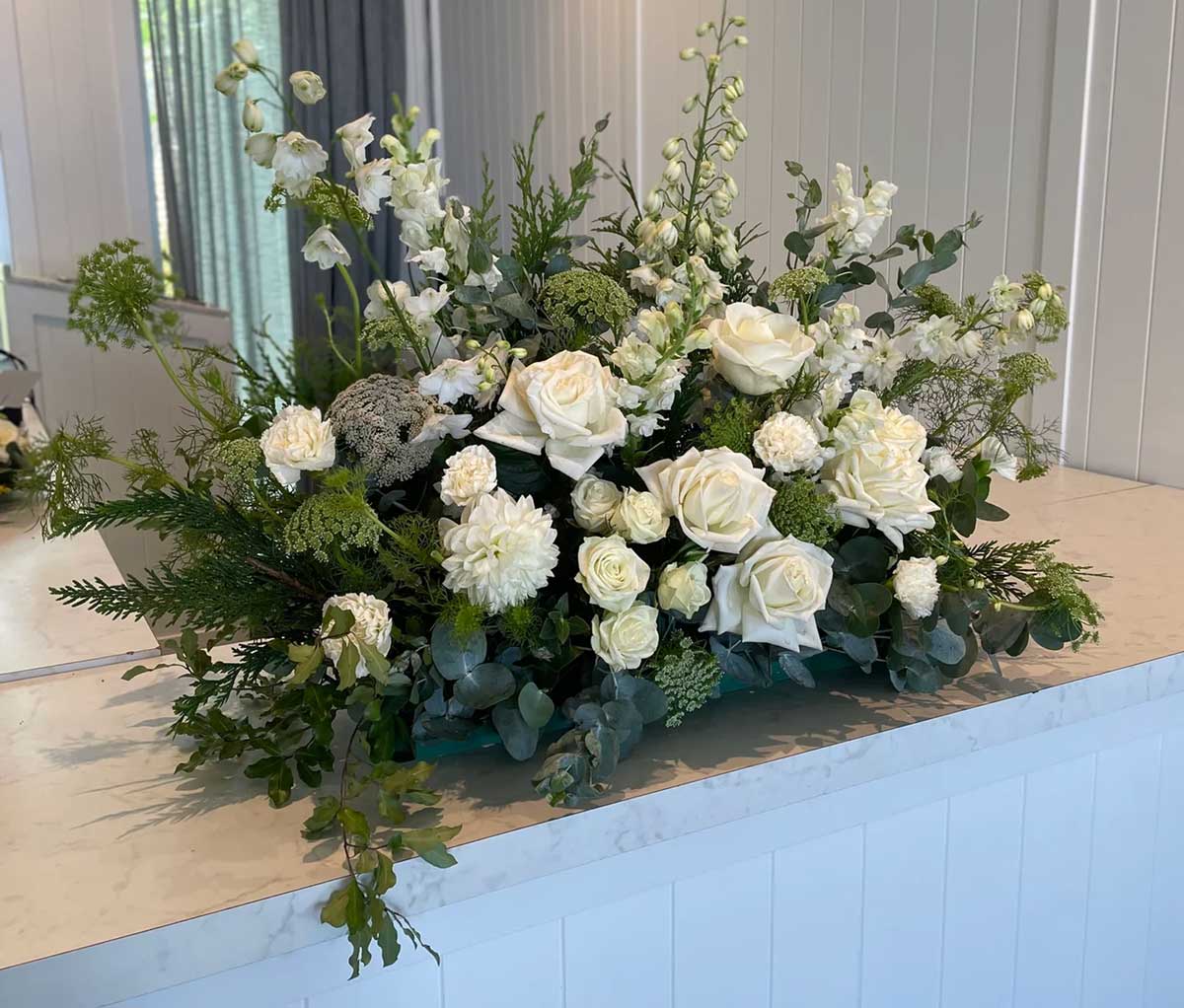 What colours of flowers are suitable for a funeral?