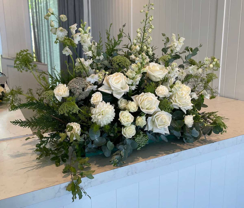 What colours of flowers are suitable for a funeral?